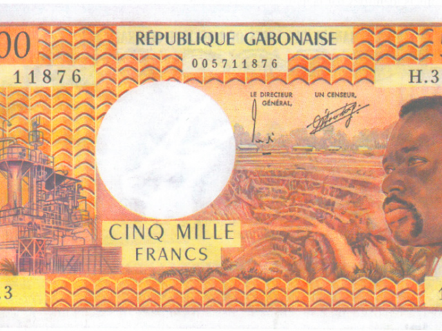 République Gabonaise, 5000 Franc CFA, BEAC 1973–2003. French assets: Uranium mines depicted in Mounana, Gabon. The French owned nuclear company Areva extracted from the mines for decades. The mines closed in the early 90’ies and the area is now a toxic no-go-zone.